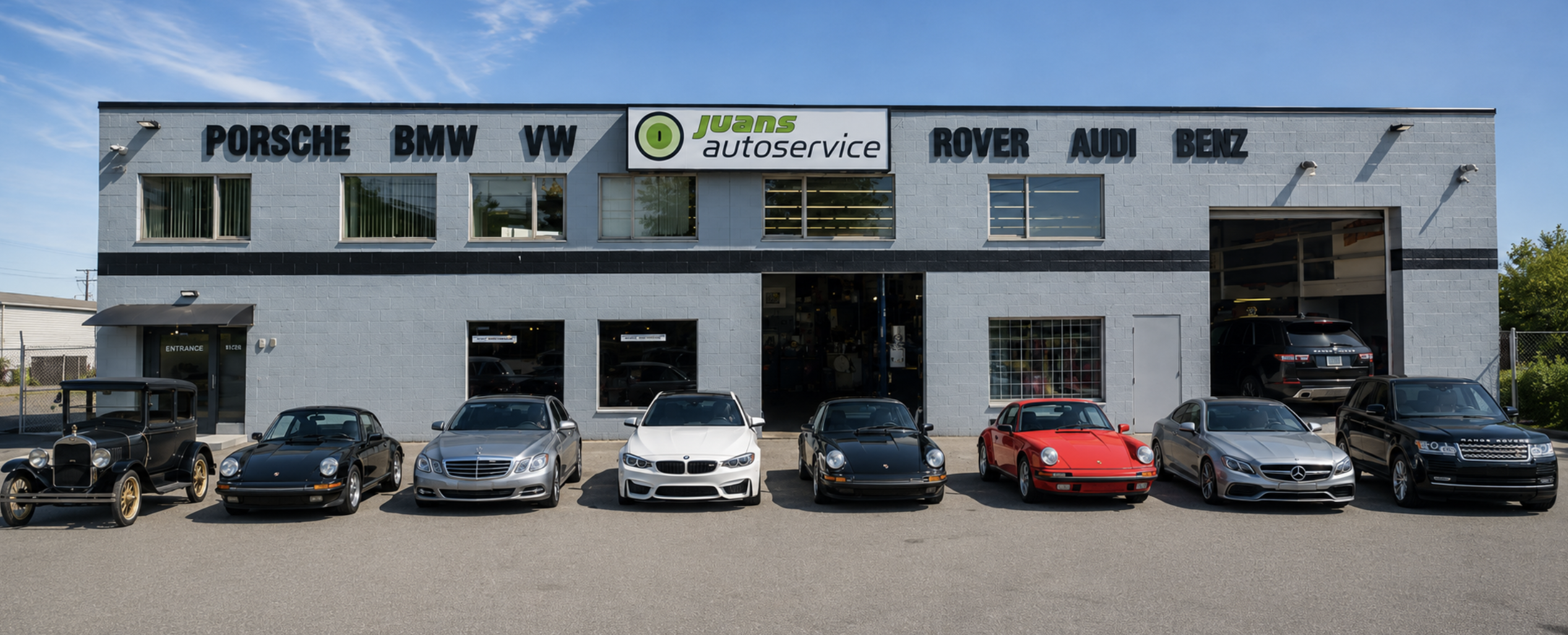 Juan's Auto Service shop on River Road with a lineup of customer vehicles