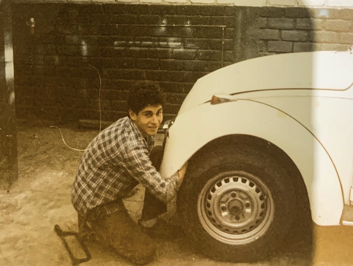 Young Juan working on a VW Beetle in Lima, Peru in the 1970s